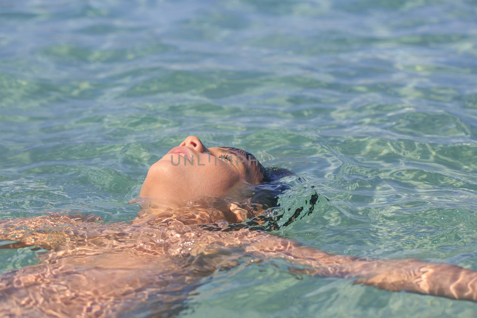 Boy swimming on the beach