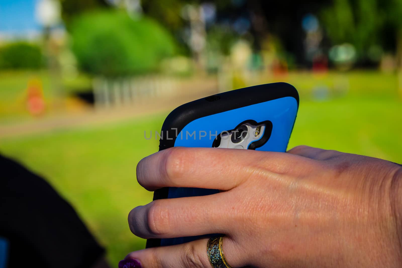 Close up of woman holding smartphone with her hand.