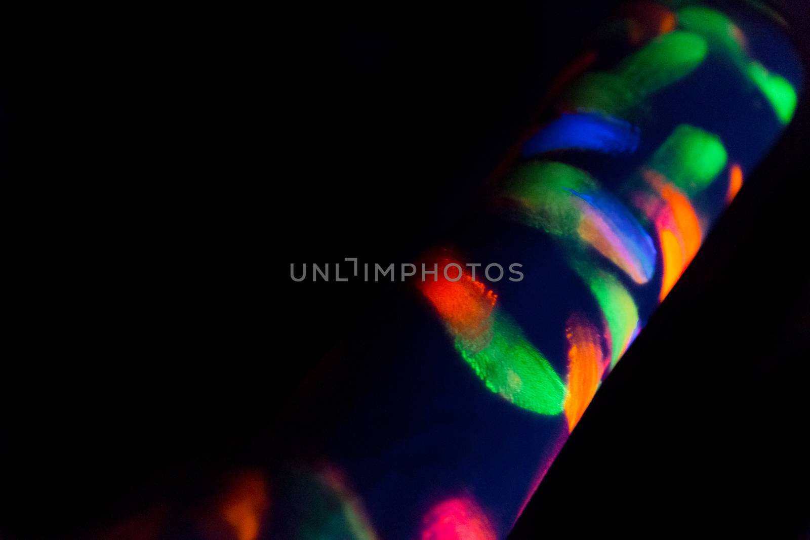 Woman with make up art of glowing UV fluorescent powder.