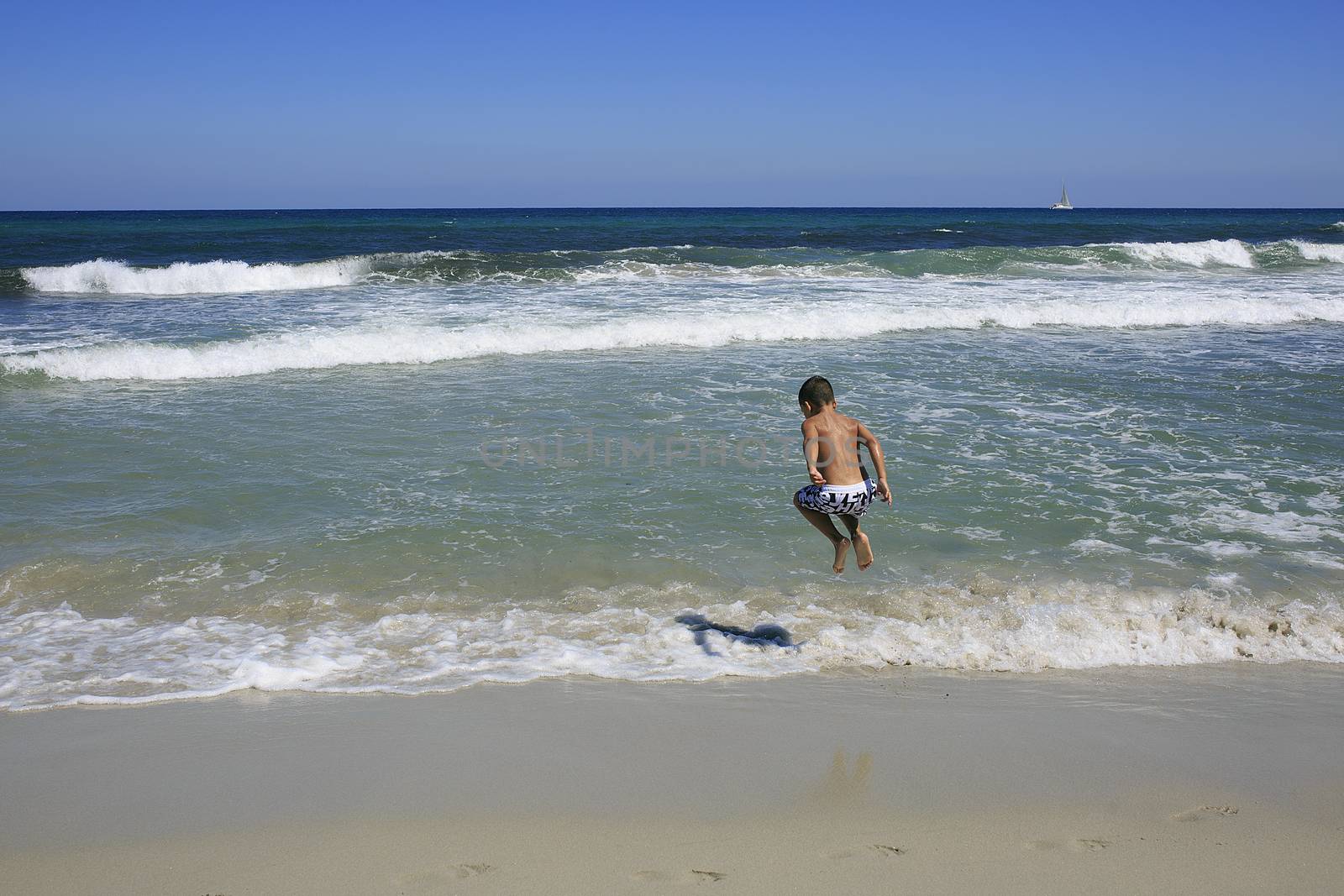 Boys playing on the beach