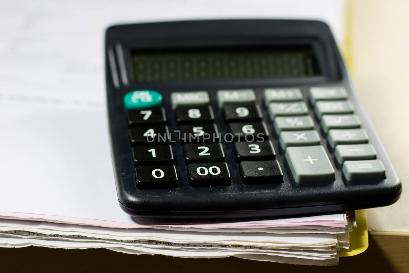 Bills, documents and papers with calculator. Office of the accounting office. Wooden table.