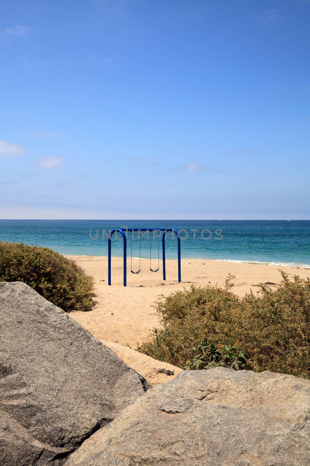 Swings on the sand at San Clemente State Beach by steffstarr