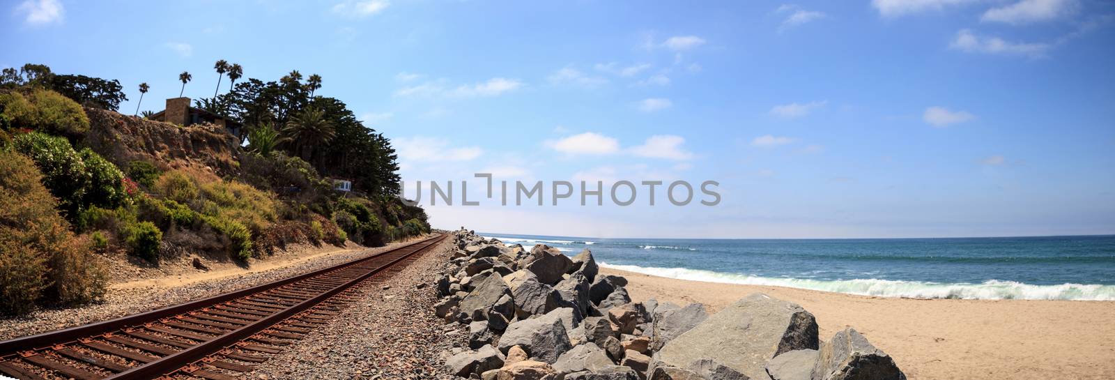 Train tracks run through San Clemente State Beach by steffstarr