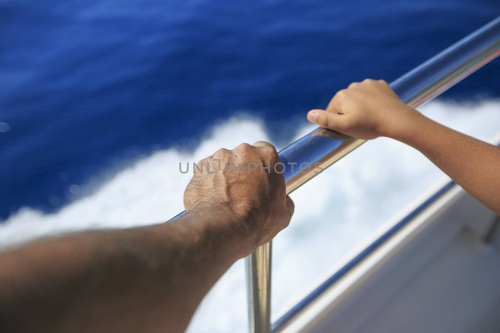 Hand of a passenger in a boat