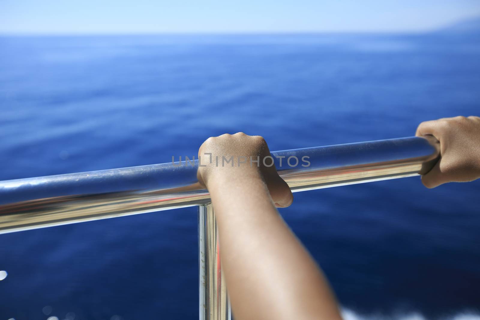 Hand of a passenger in a boat