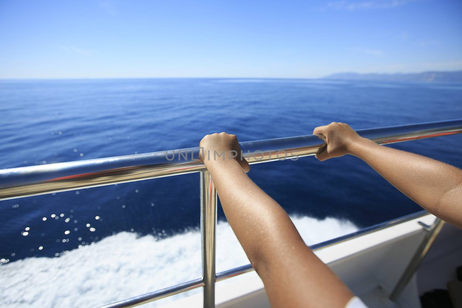 Hand of a passenger in a boat