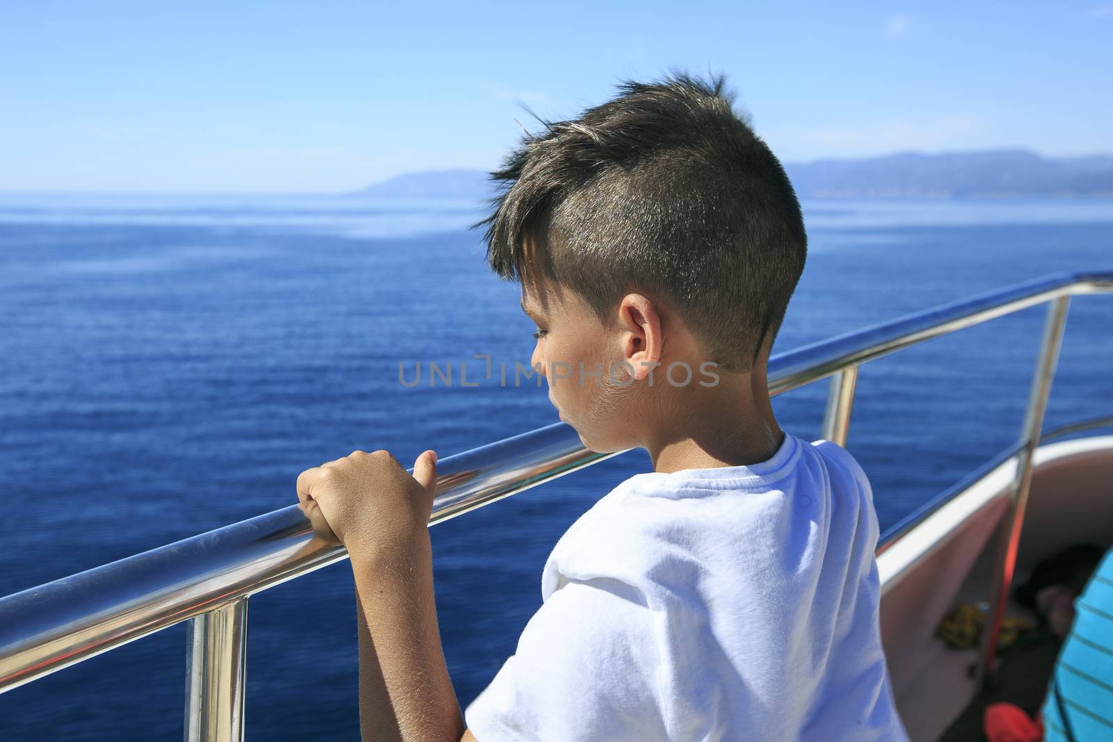 Boy in a deck of a cruise