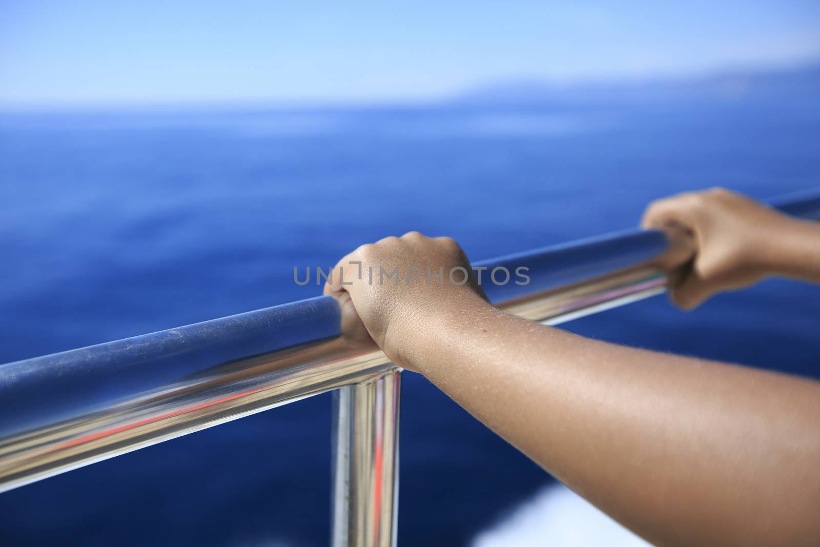 Hand of a passenger in a boat
