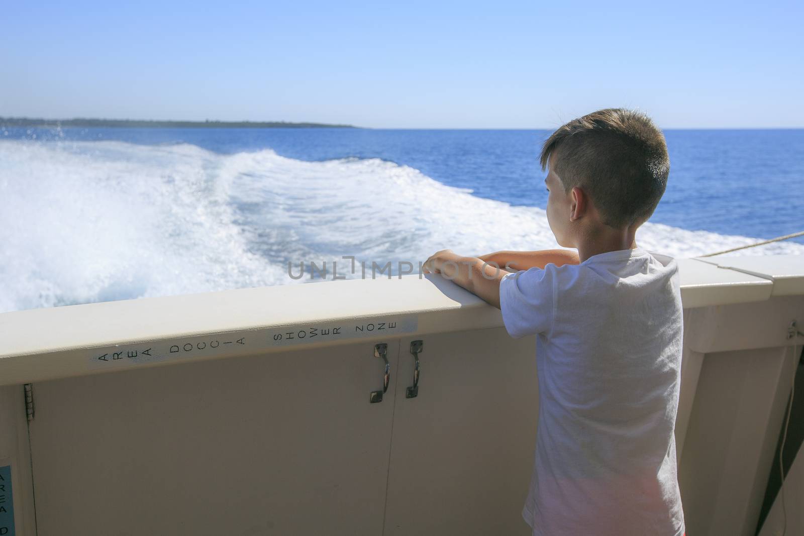 Boy in a deck of a cruise