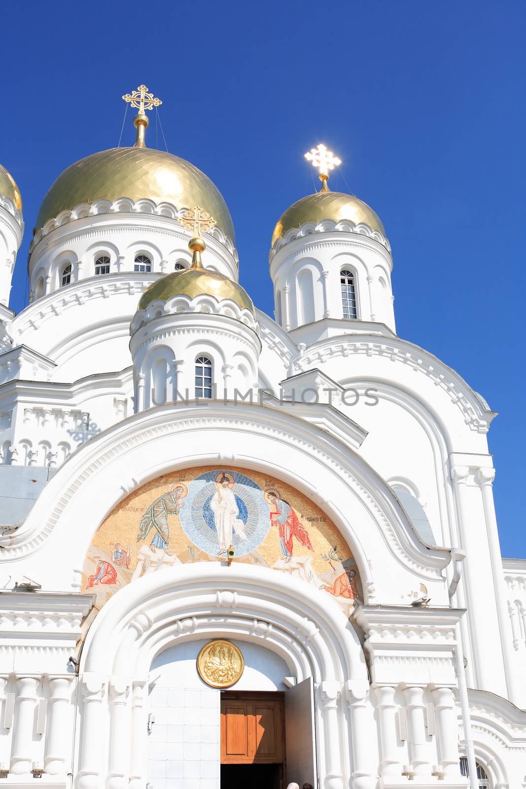 Closeup of ancient Russian Cathedral in Diveevo city against blue sky