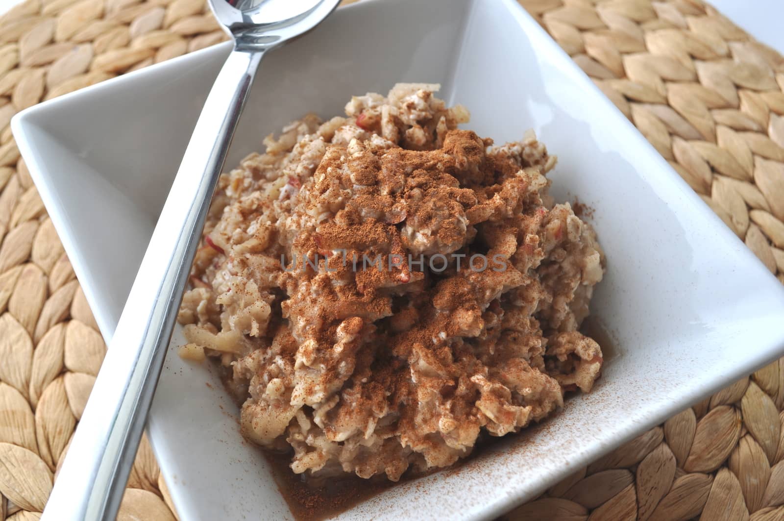 Food - Healthy breakfast - oat flakes with grated apple and mashed banana sprinkled with cinnamon by Akvals