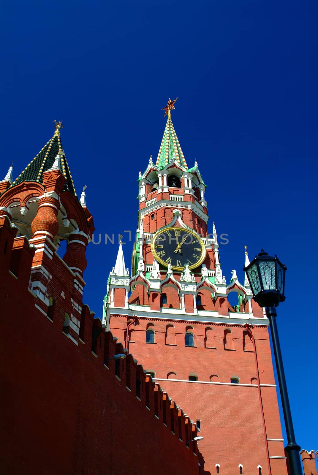 View on Moscow Red Square Kremlin tower Spasskaya Bashnya with Chiming Kuranti Clock. Moscow Kremlin Red Square best famous sightseeing places for tourist holidays vacations tours. Famous monuments