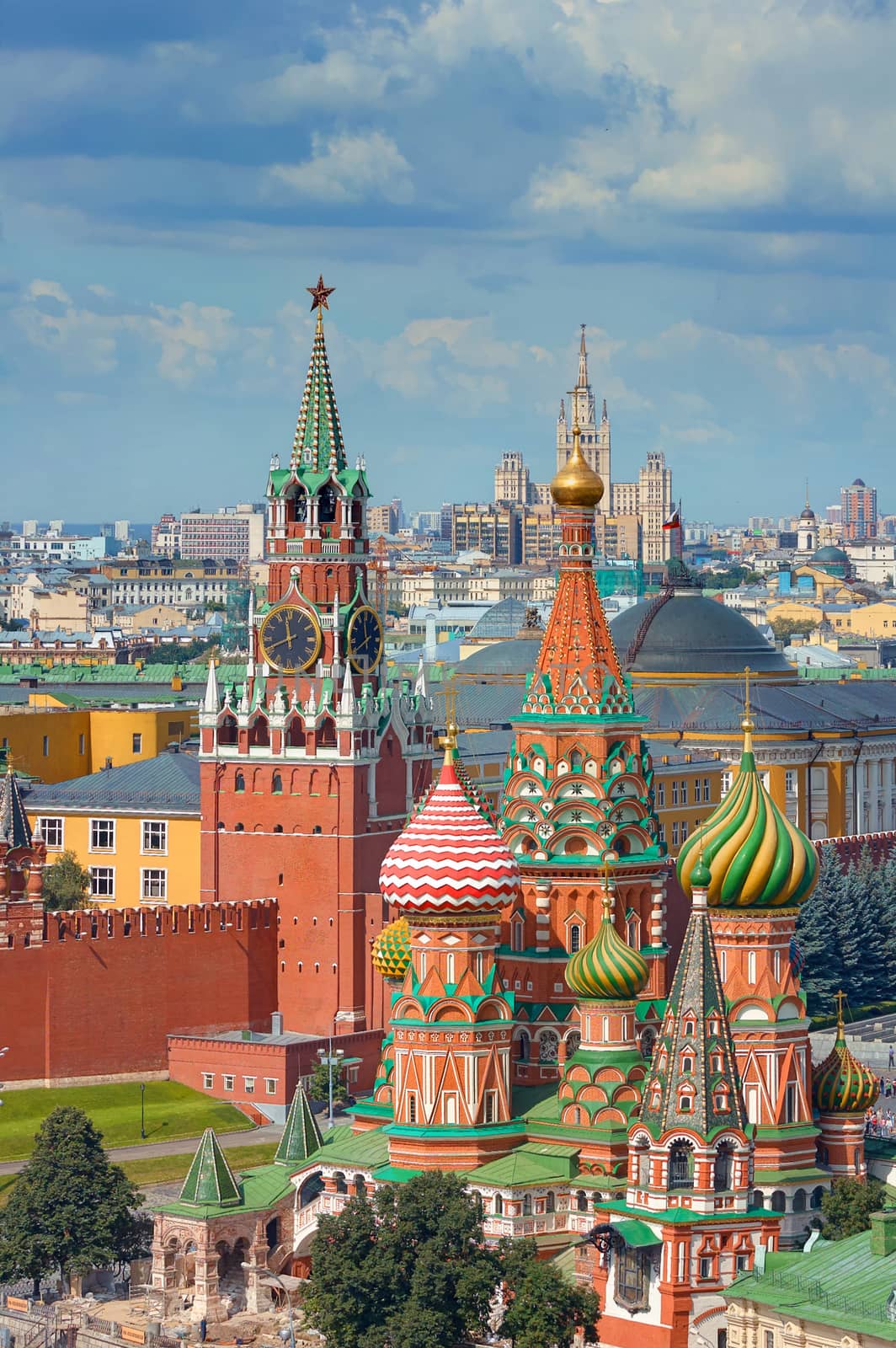 View on Moscow Red Square, Kremlin towers, stars and Clock Kuranti, Saint Basil's Cathedral church. Panorama from hotel Russia. Moscow holidays vacation tours famous sightseeing tours travel by mikhail_leonov