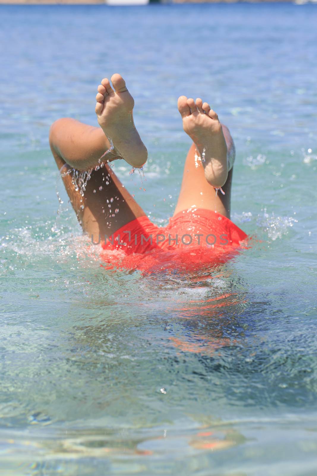 Boy swimming on the beach