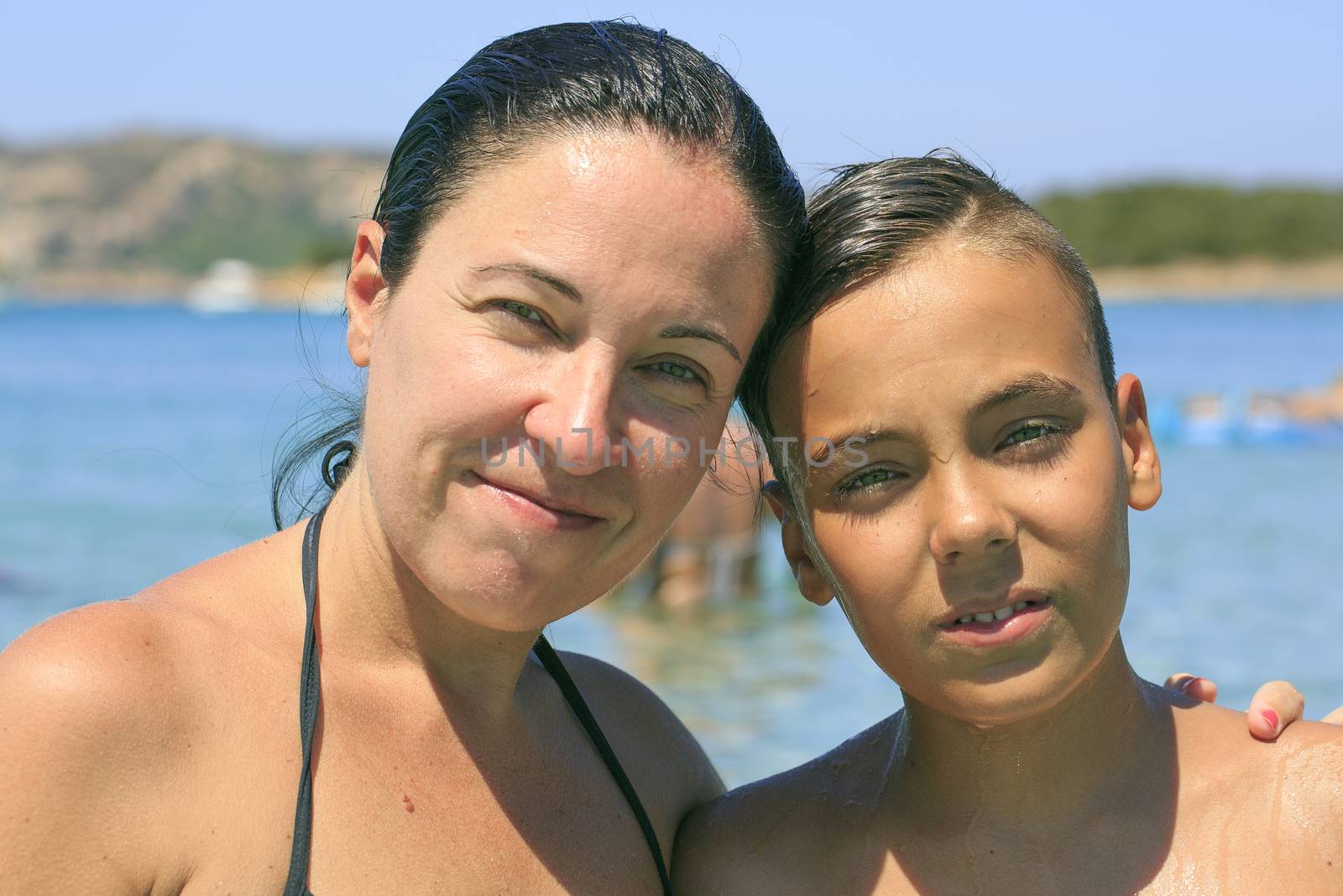 Family swimming on the beach