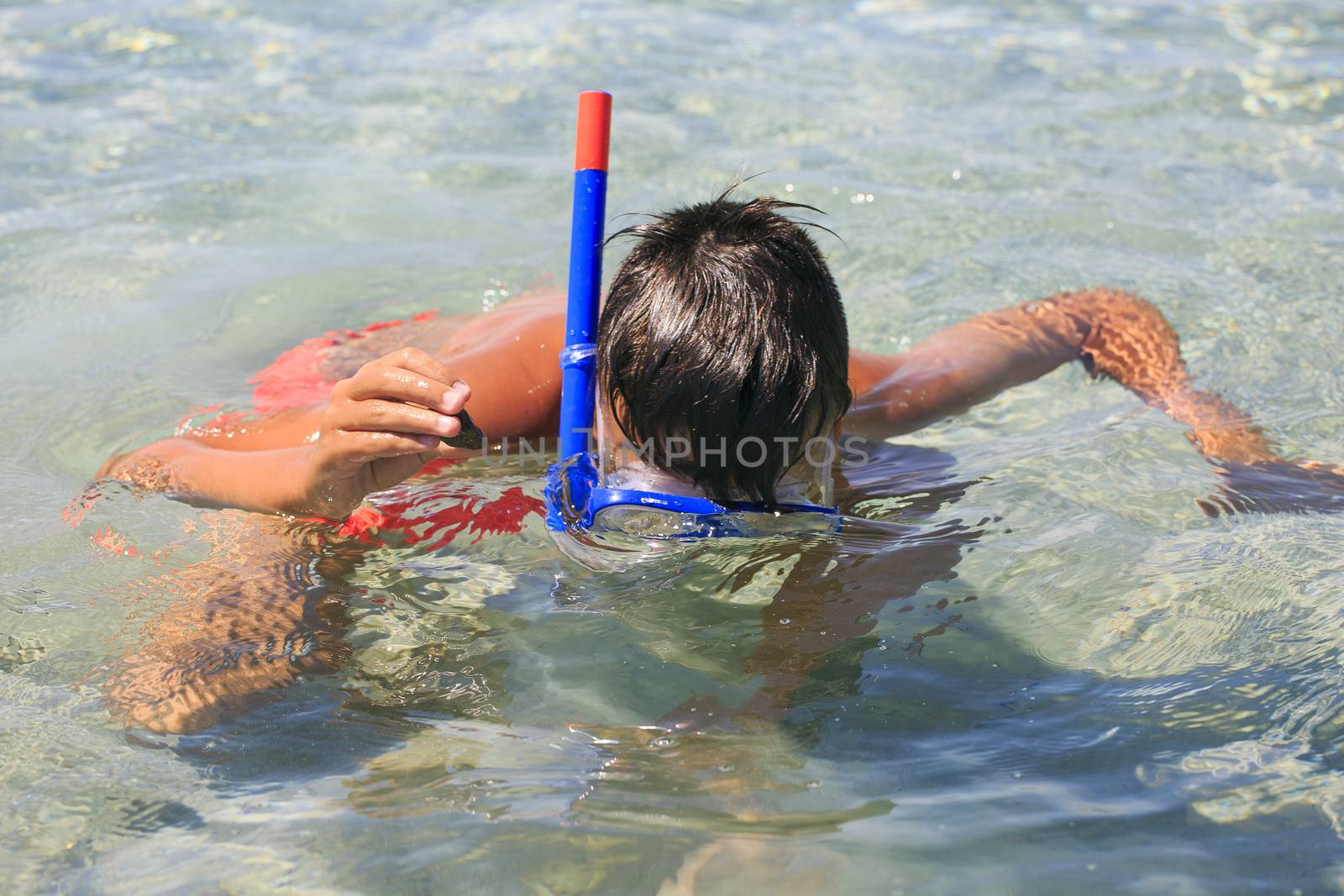 Boy with snorkeling mask by nachrc2001