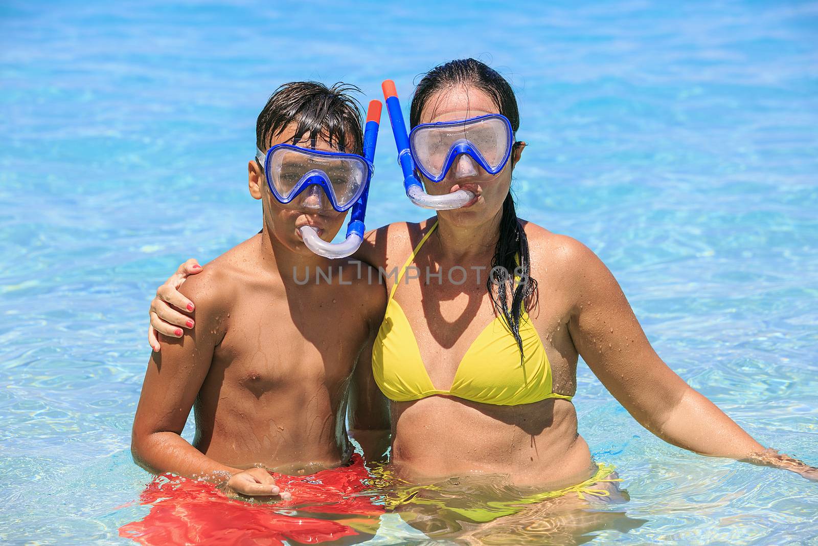 Mother and son snorkeling on the beach by nachrc2001