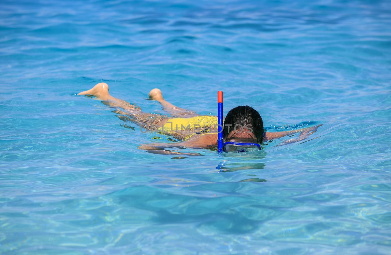 woman snorkeling on the beach