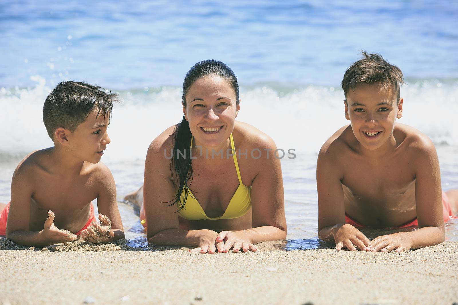 Family swimming on the beach