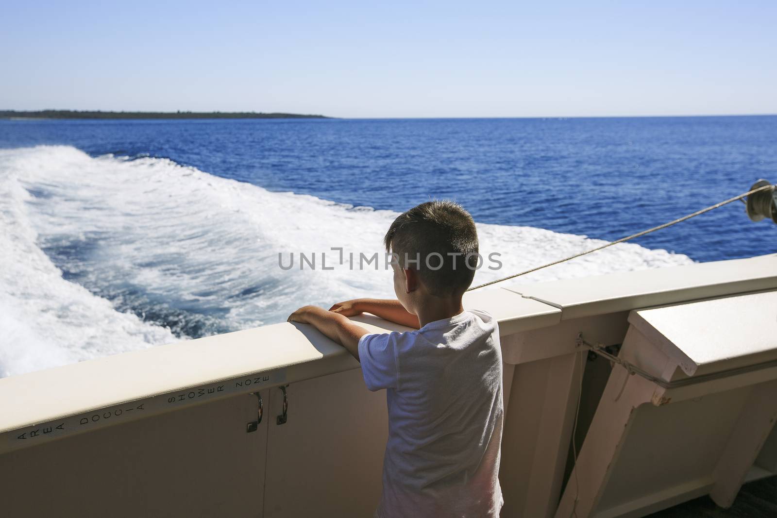 boy seeing the sea on a boat