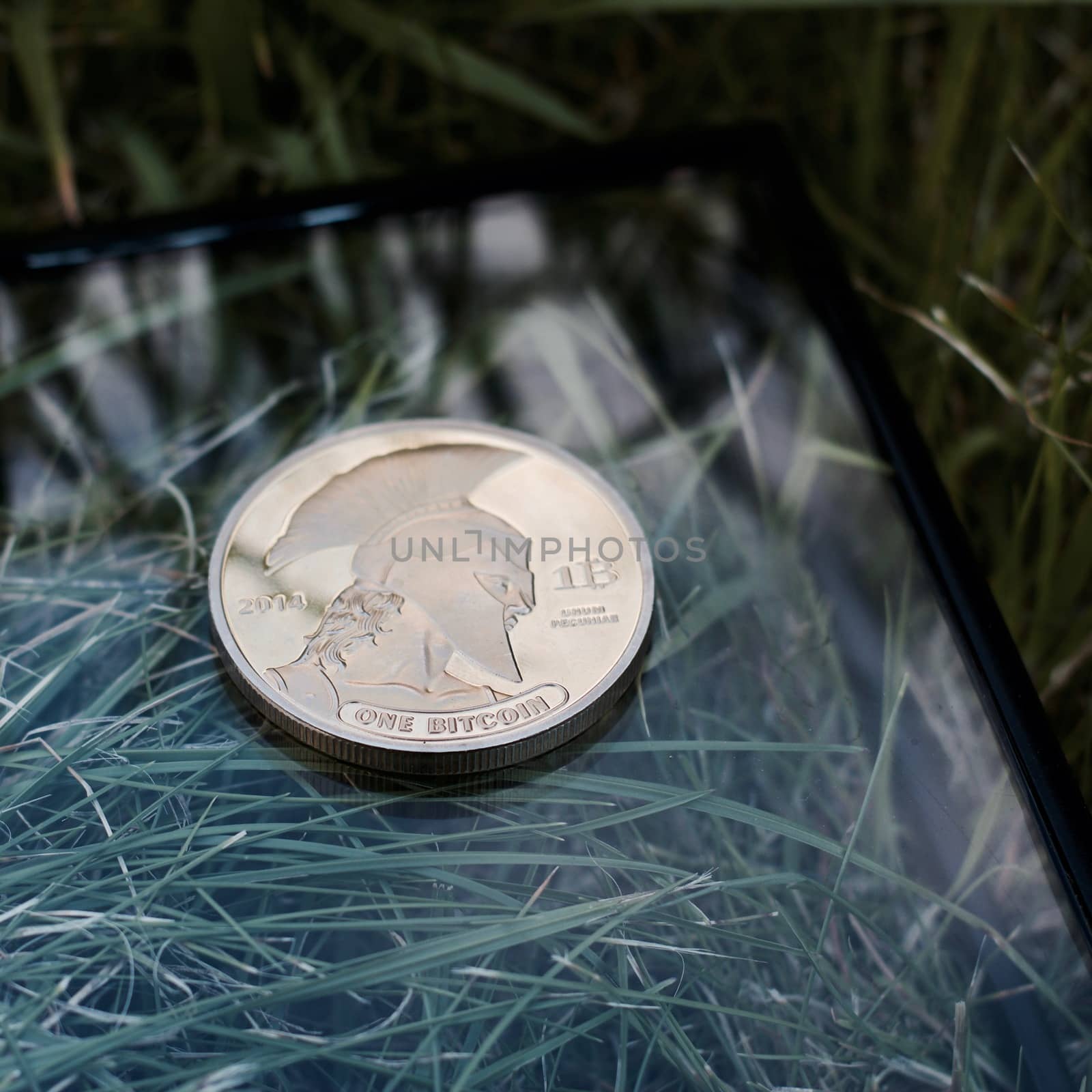 Digital currency physical metal bitcoin coin. Virtual money concept.