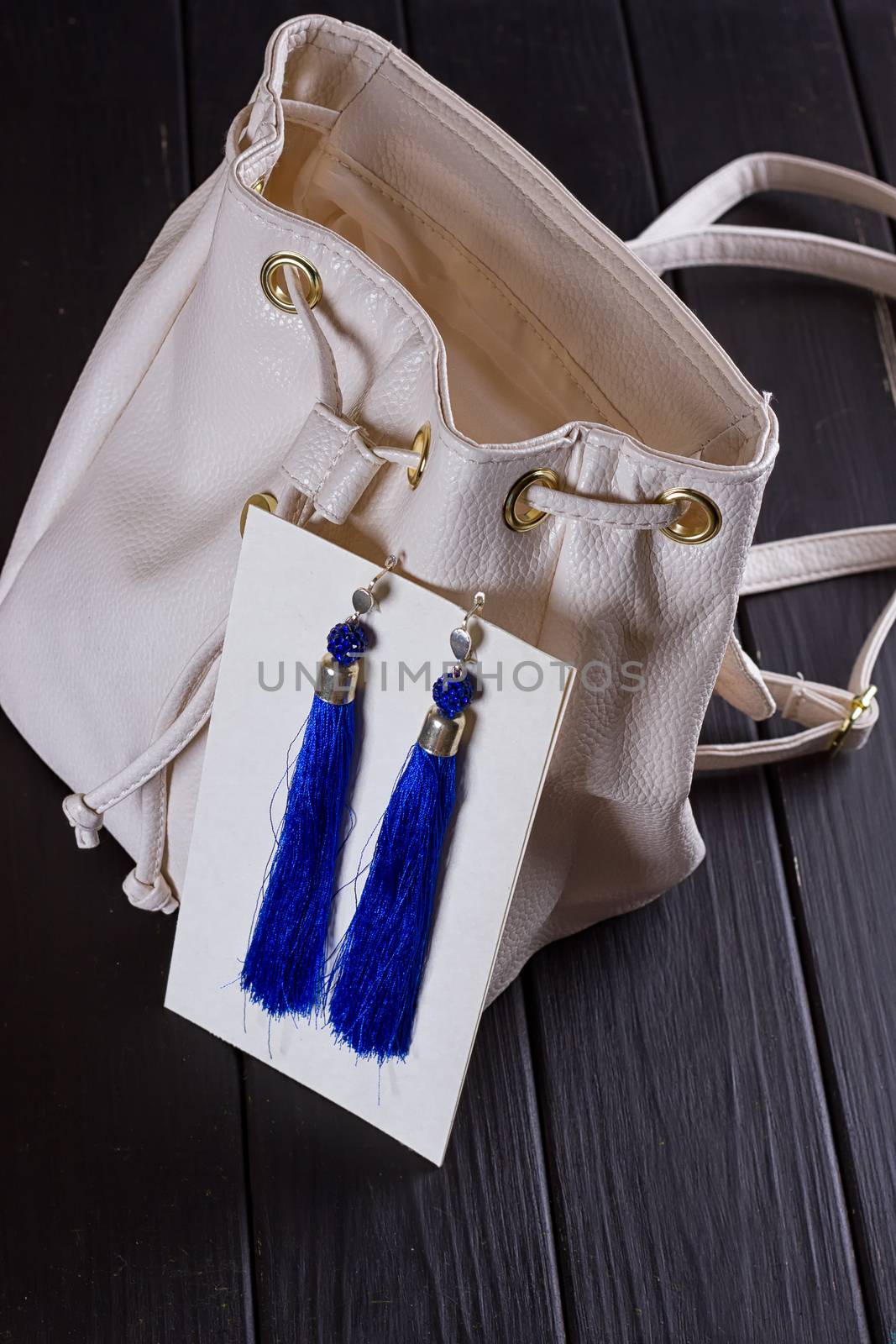 small white leather woman's backpack and blue earrings of thread by victosha