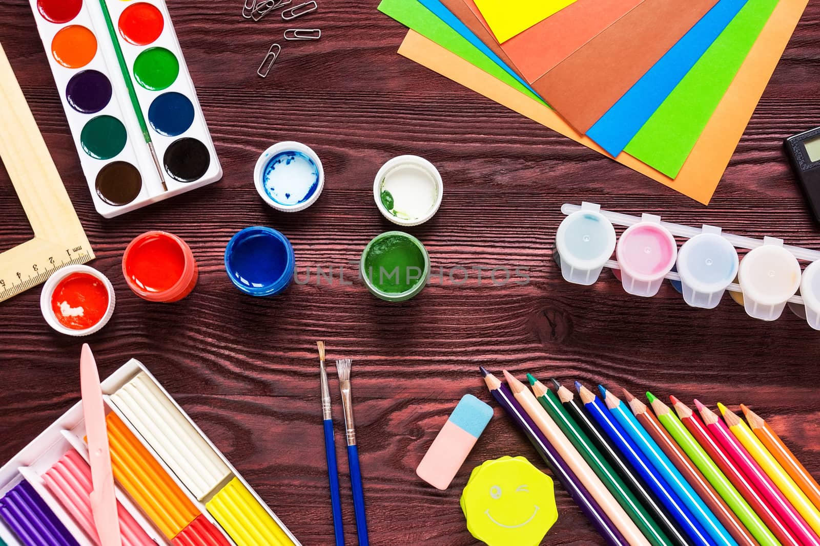 School supplies on a red background by AlexBush