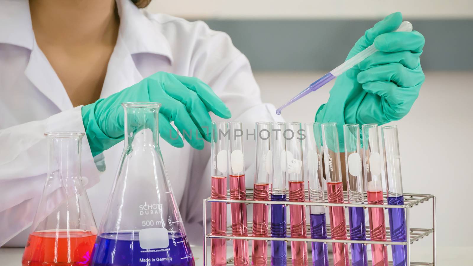 scientist with equipment and science experiments in laboratory