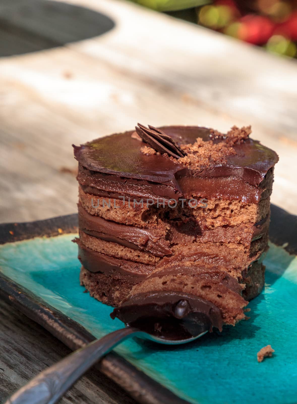 Creamy chocolate mousse layered cake with rich fudge icing