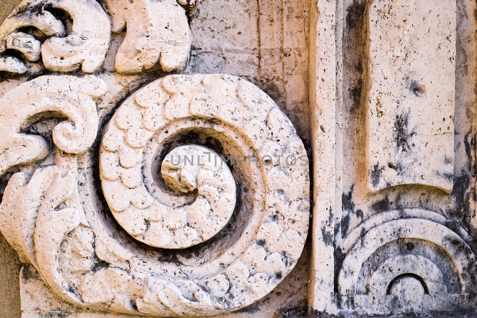 Detail of old house in baroque style in Italy