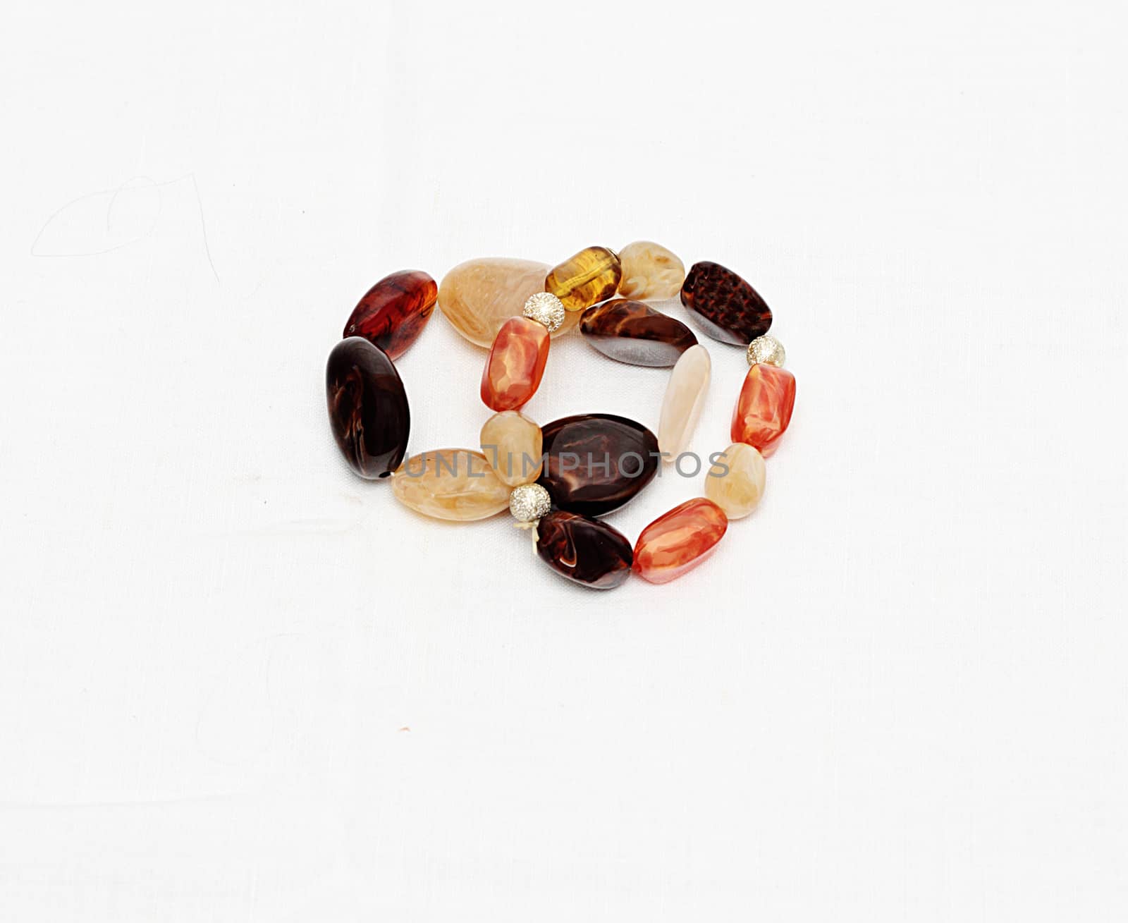 Two female bracelets from semi-precious stones isolated against white background.