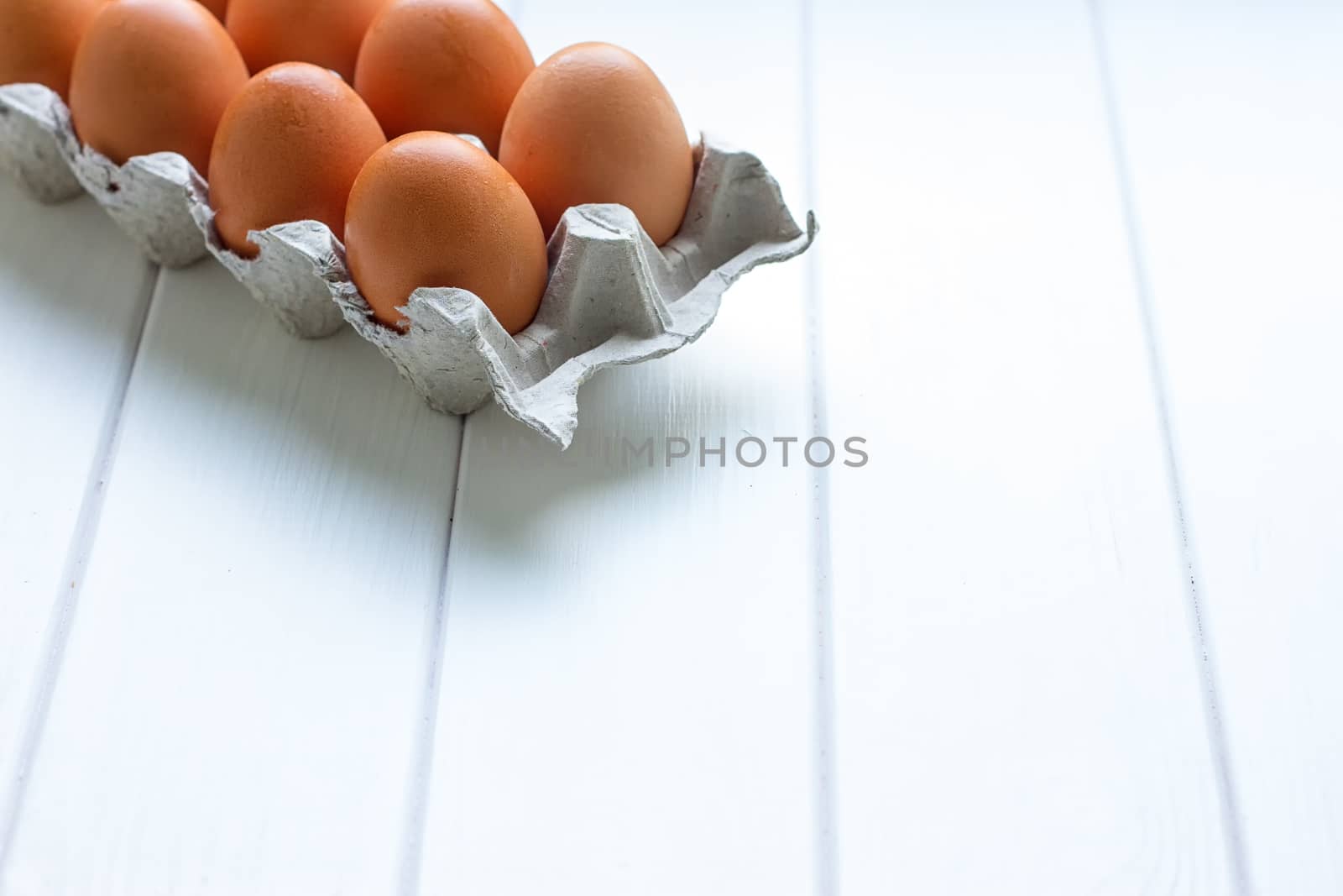 Eggs in the paper tray package on white background.