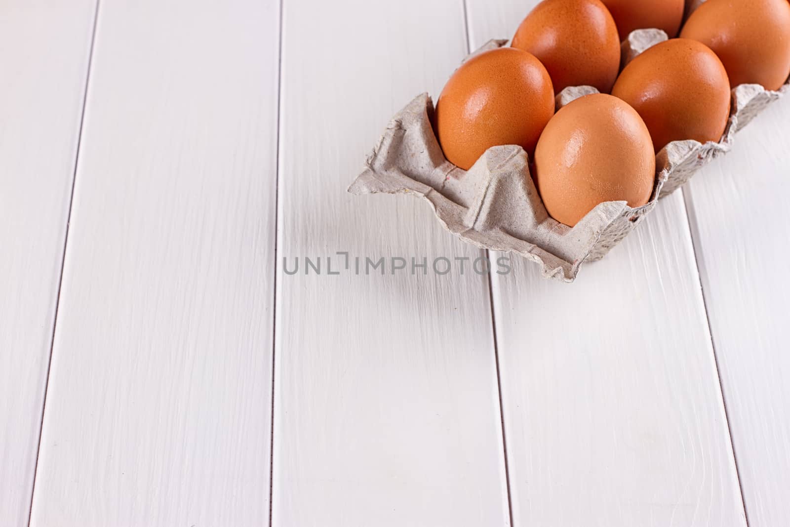 Eggs in the paper tray package on white background.