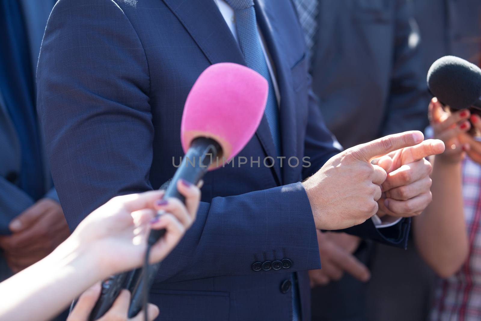 Media interview. Hand gesture. Business person. by wellphoto