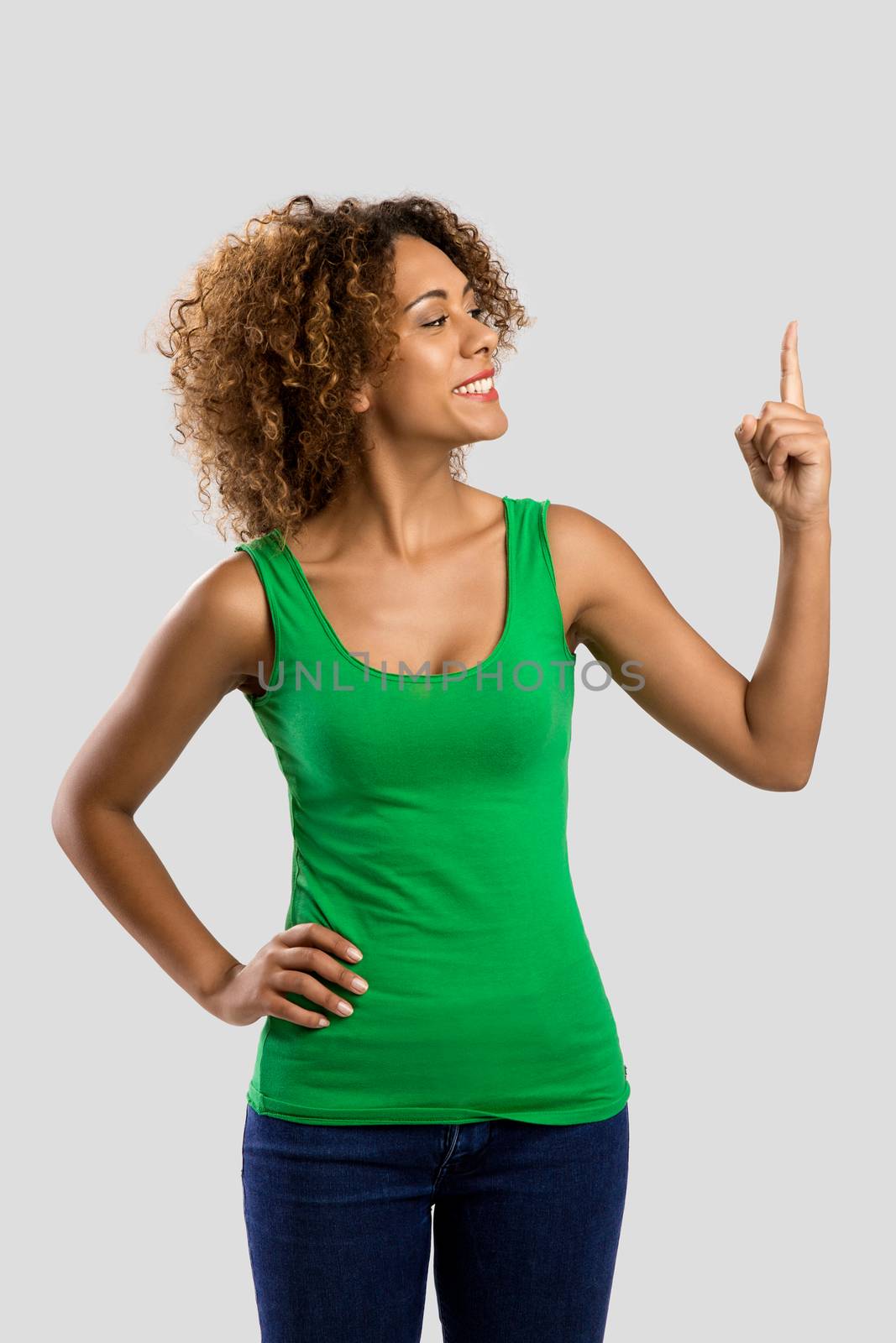 Beautiful African American woman showing and looking to her finger