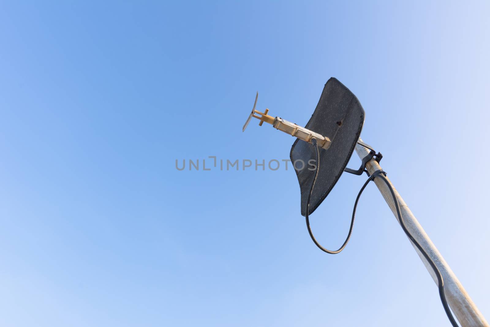 satellite dish with blue sky. by ahimaone