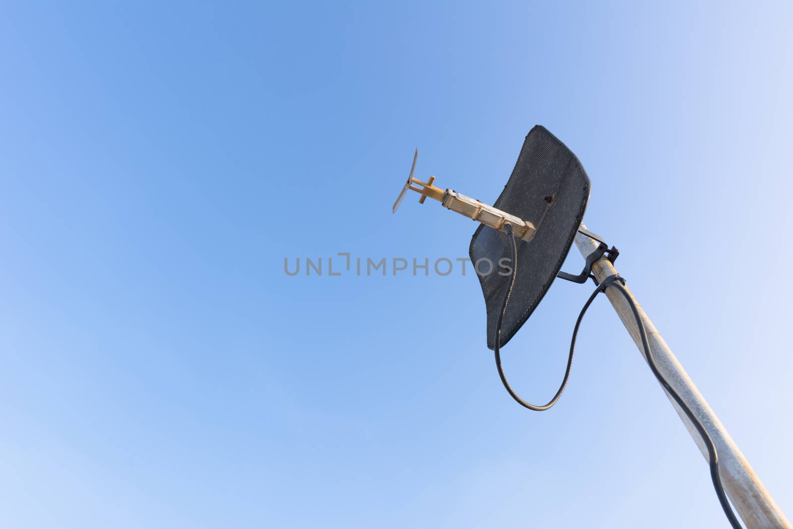 satellite dish with blue sky.