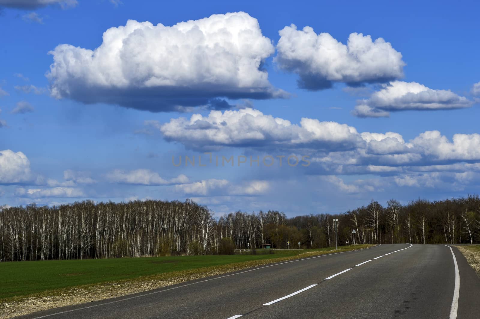 Road without cars with clouds by AlisLuch