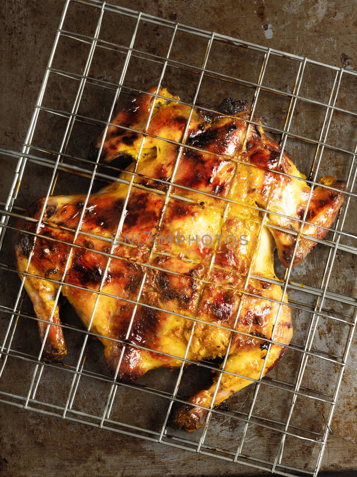 close up of rustic barbecued whole chicken