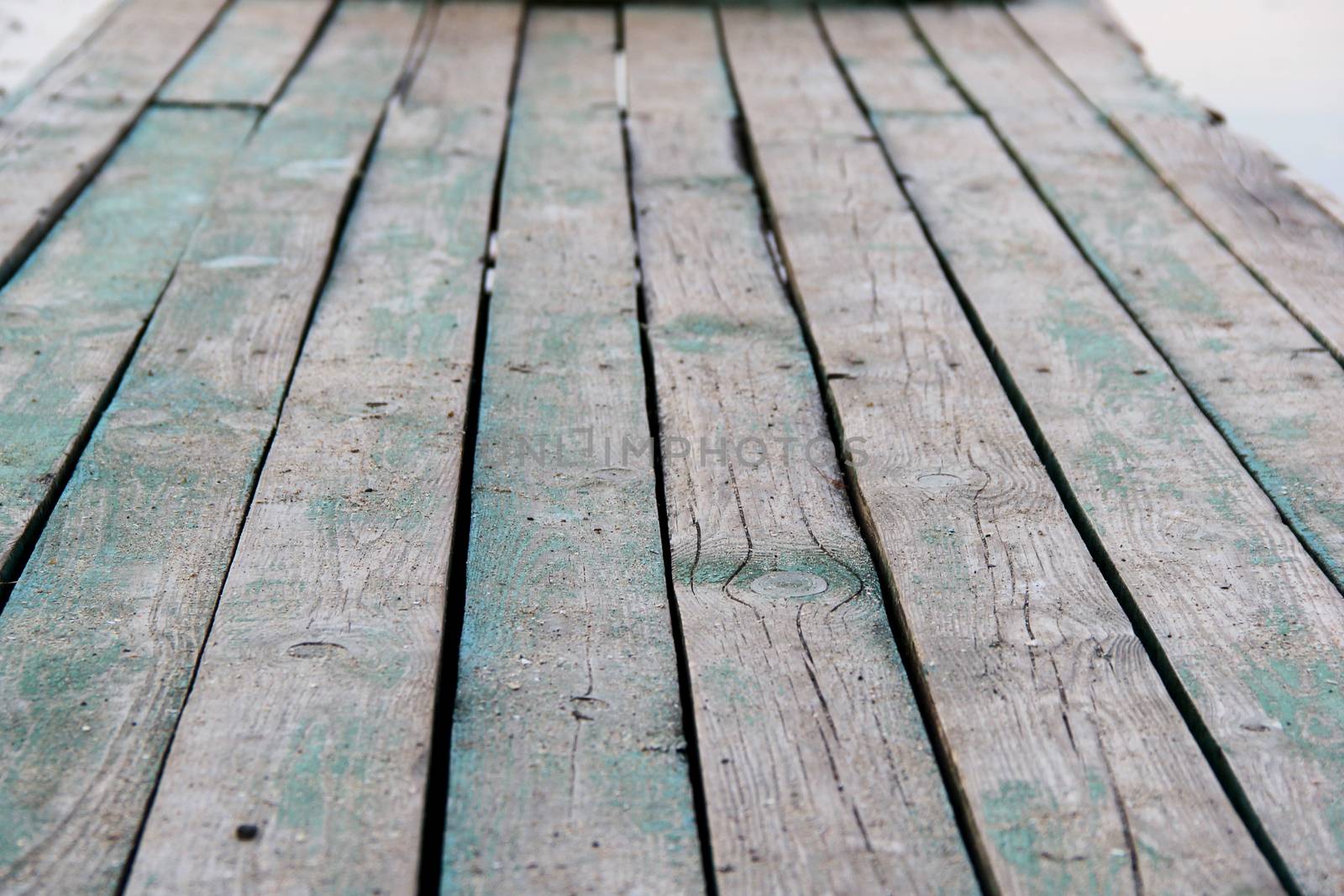 old green and gray wooden platform. photo