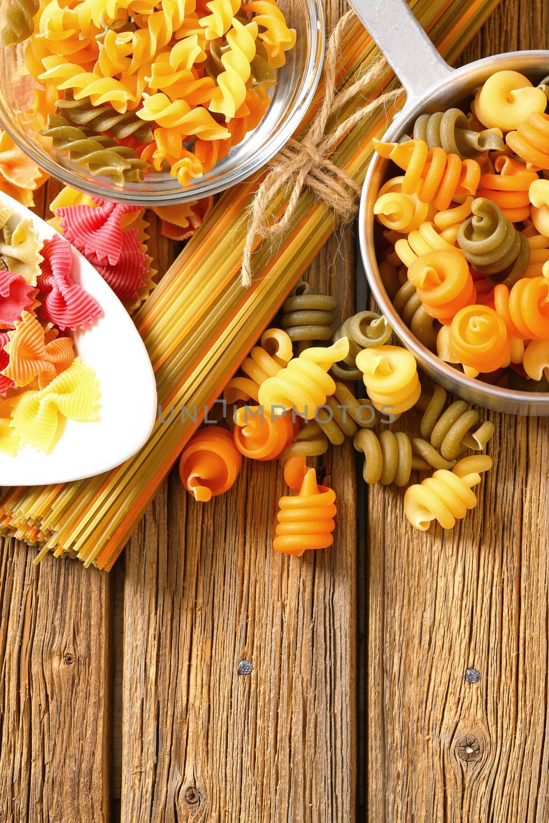 Various types of coloured pasta by Digifoodstock