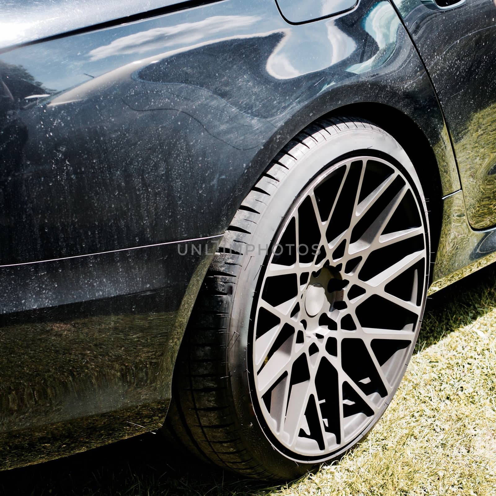 Black dirty car with nice big black wheels. Sport design car. Black body.