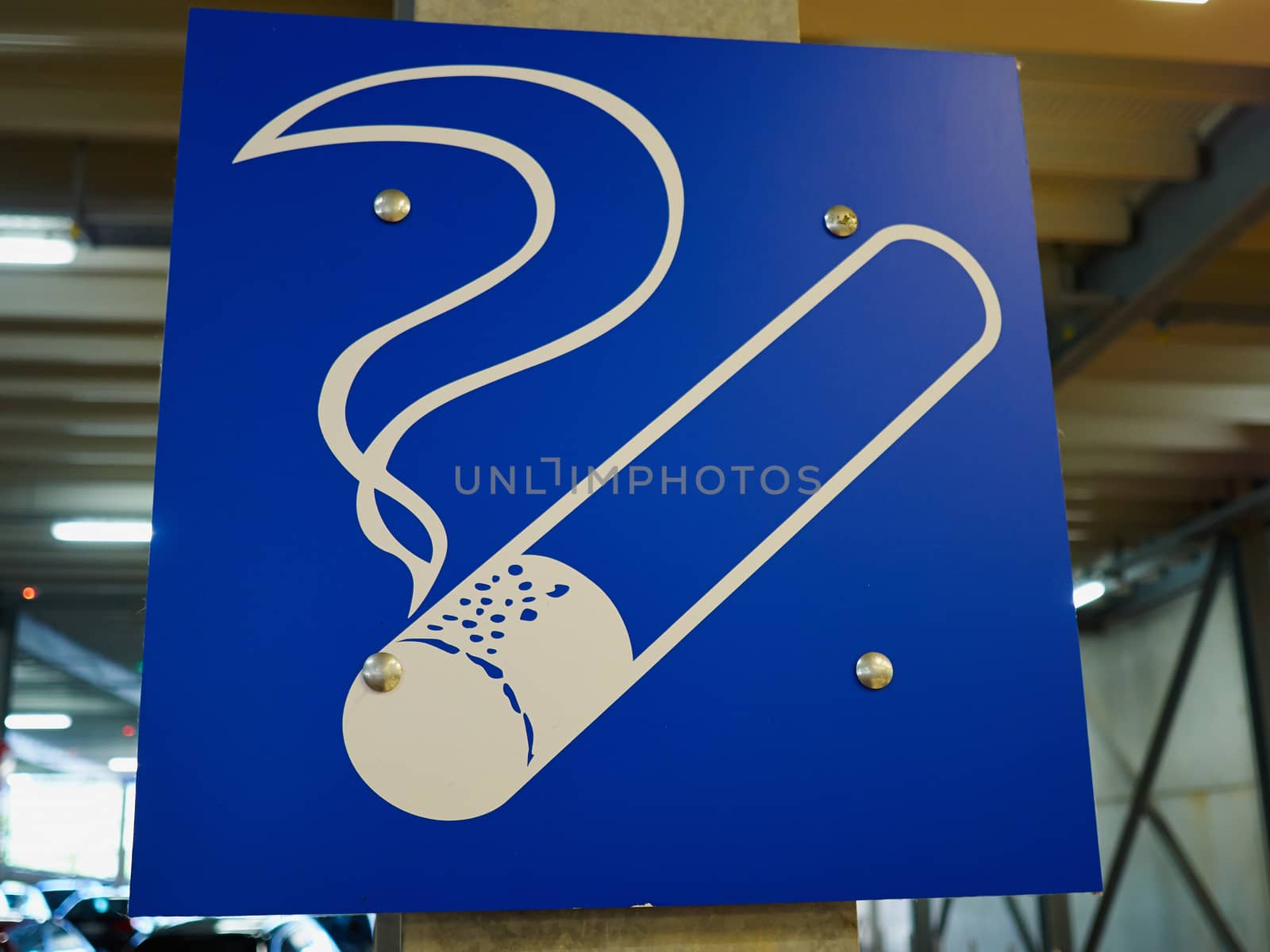 Designated blue graphic smoking area zone sign in a public building        
