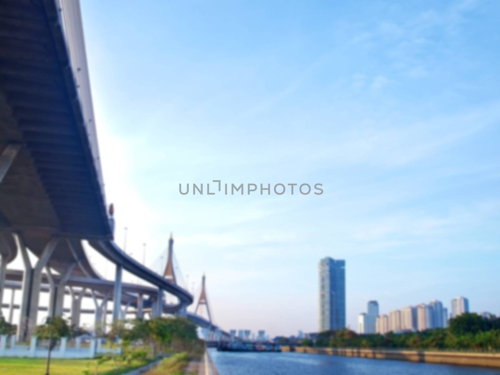 Blurred Bhumibol bridge with skyscraper and floodgate, Samut Prakarn,Thailand