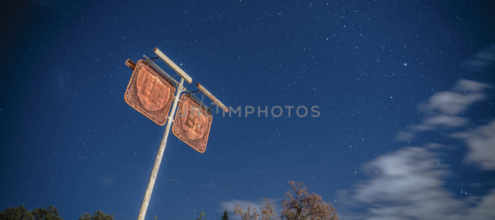 Old rustic fuel station sign in the countryside by artistrobd