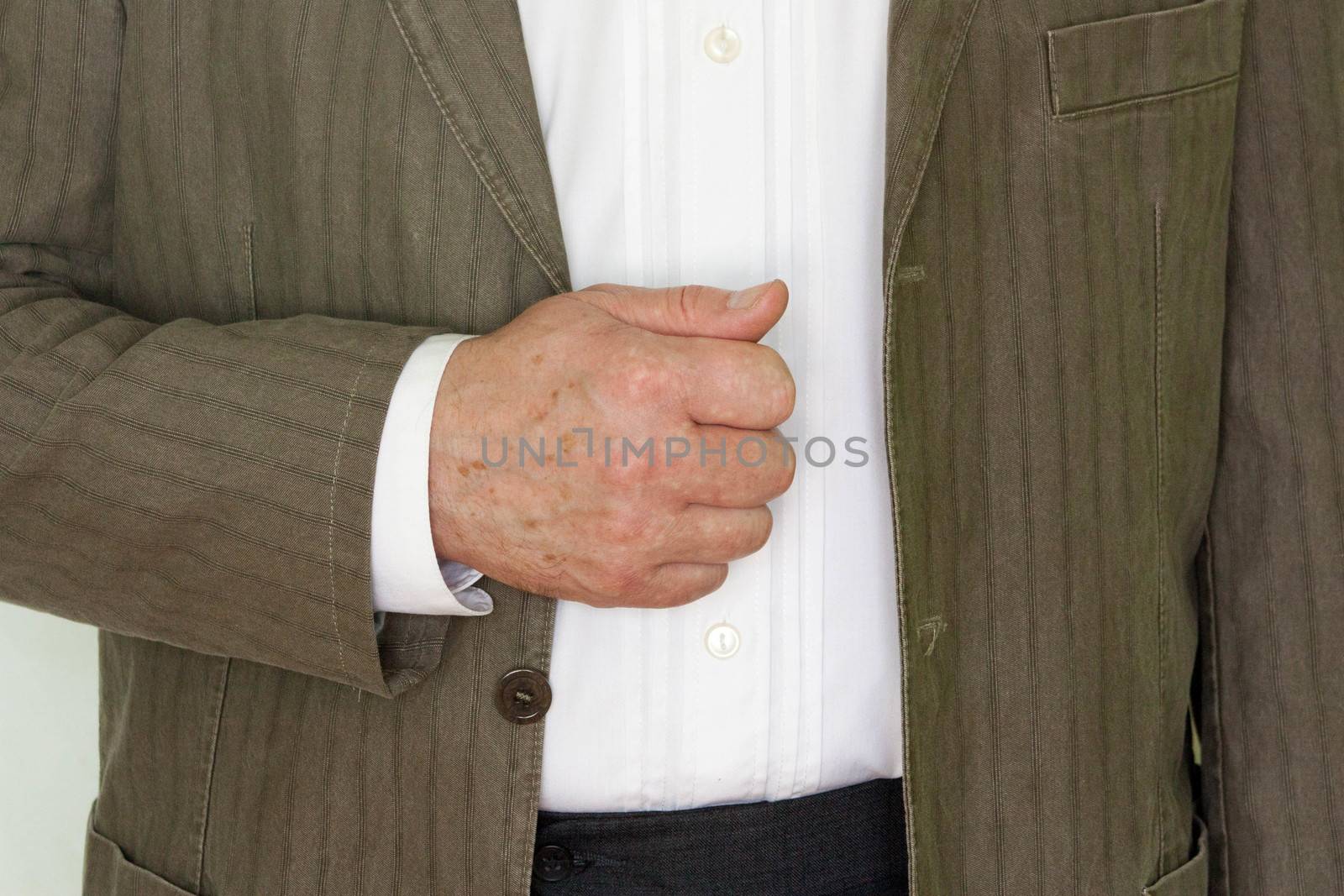 Business training concept. Photo for your design. A man stands and holds his hand with his fist