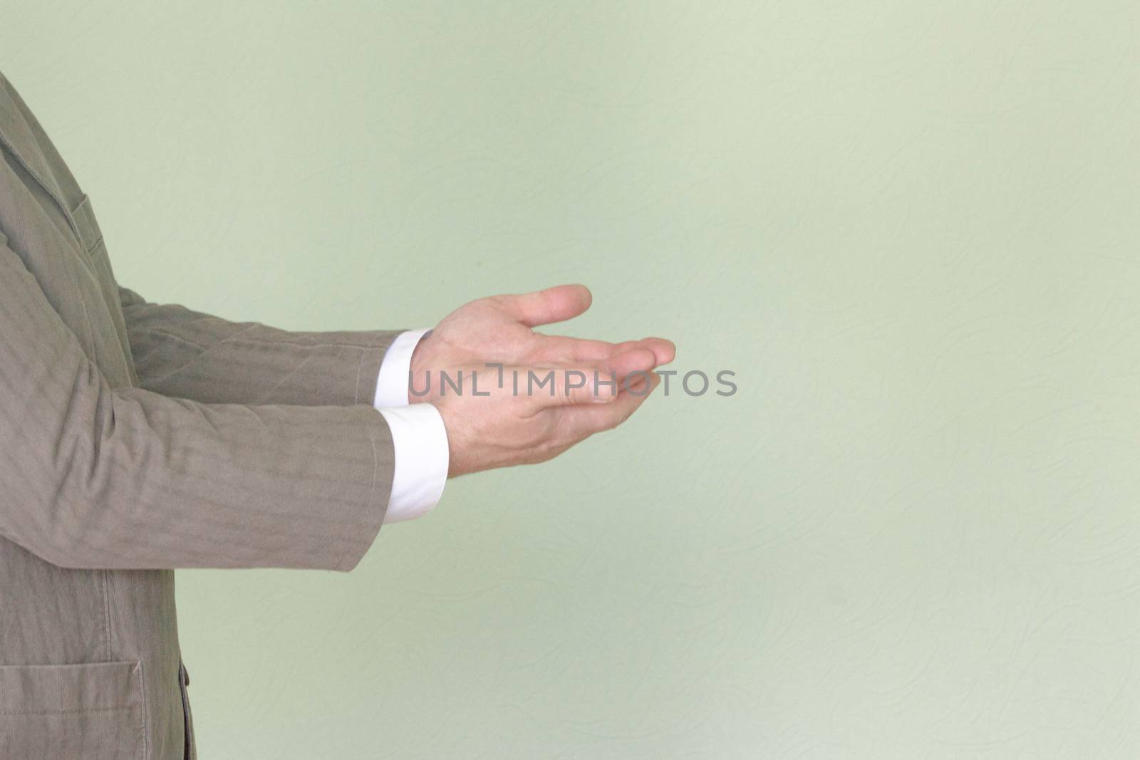 Business training concept. Photo for your design. The man is holding his hands in profile