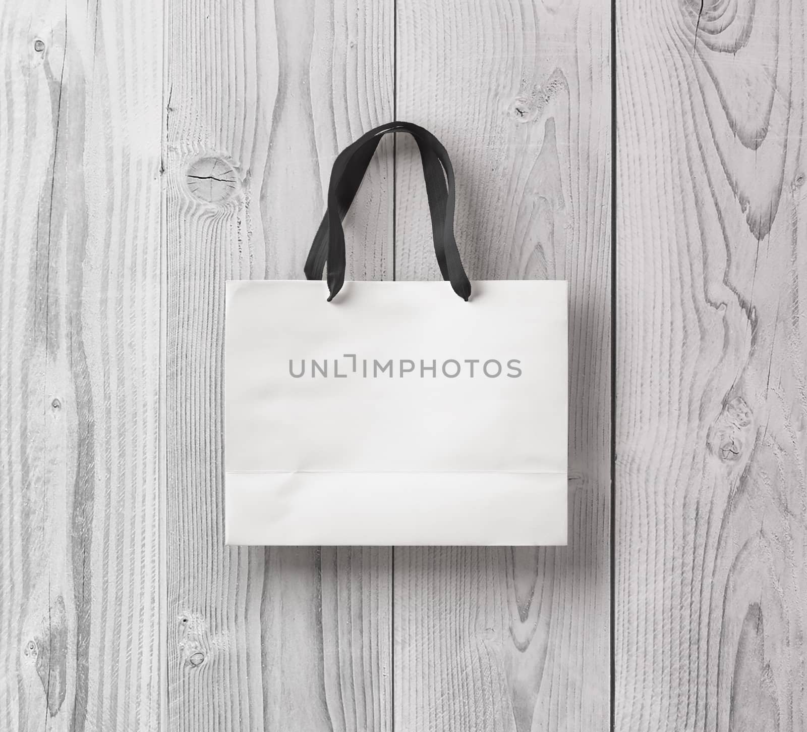 paper bag for shopping on a wooden background