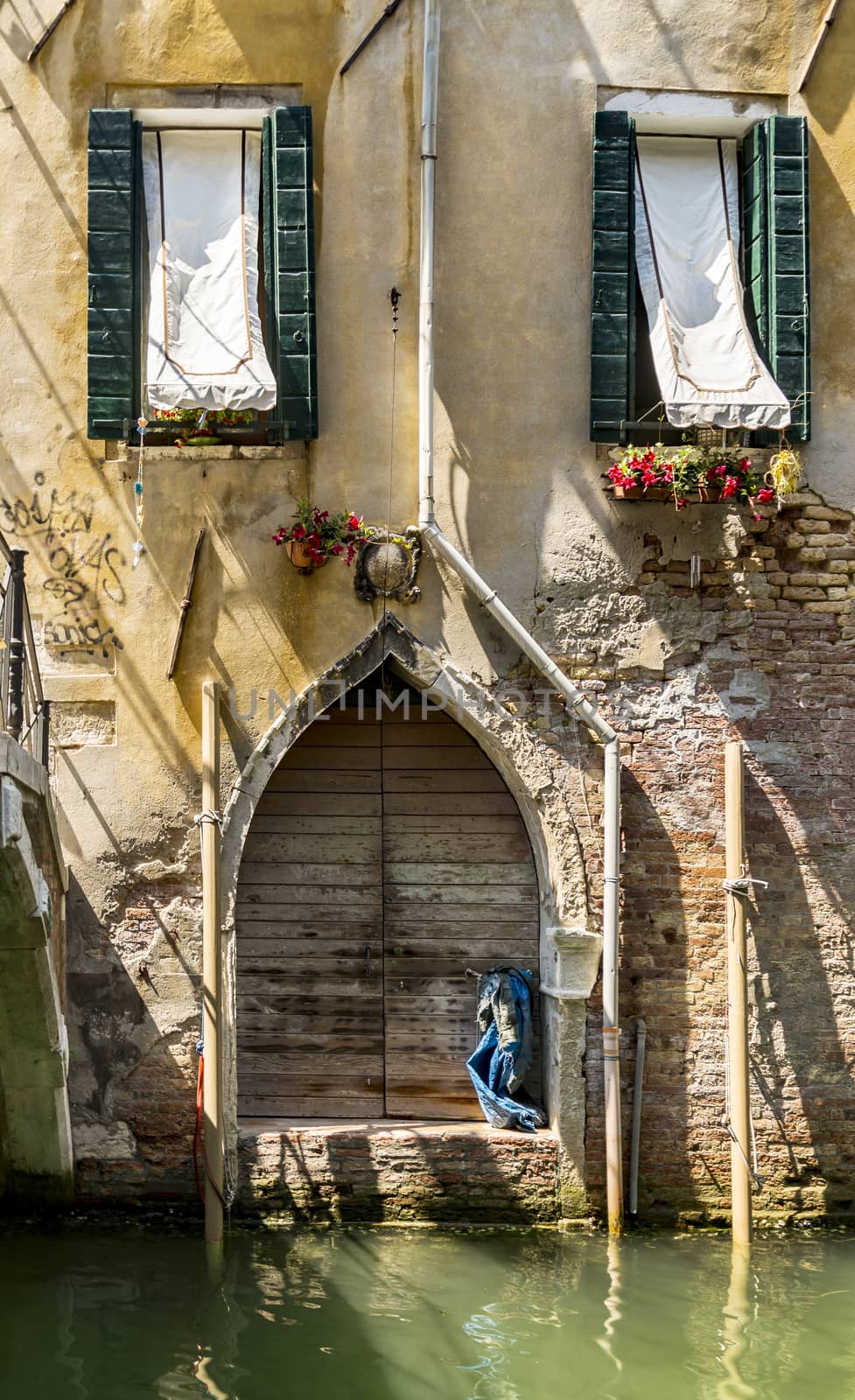 Old building along canals in Venice, Italy