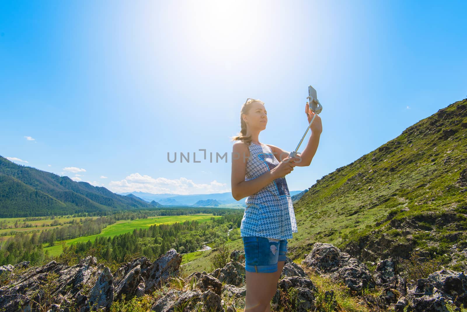 Woman taking selfie on mobile phone by rusak